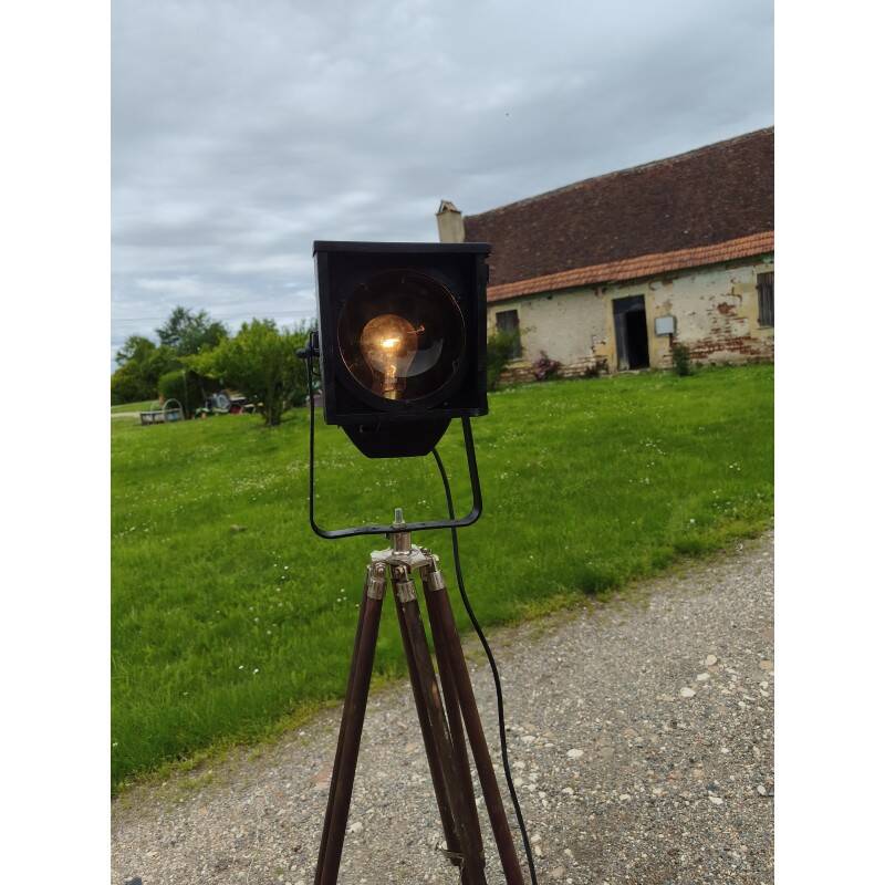 Spotlight on wooden and chrome tripod.