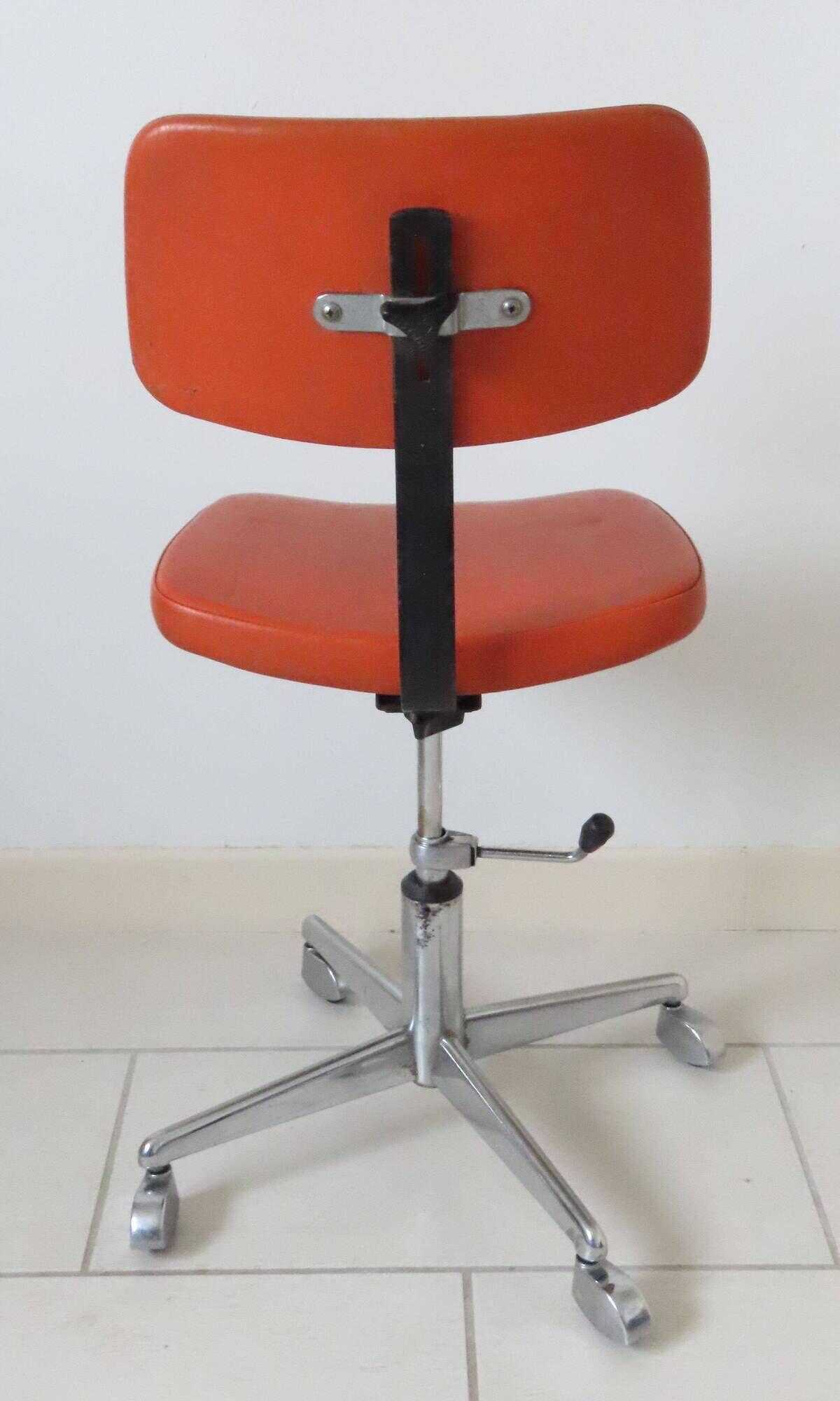 Eurosit vintage industrial workshop chair in chromed metal and orange imitation leather