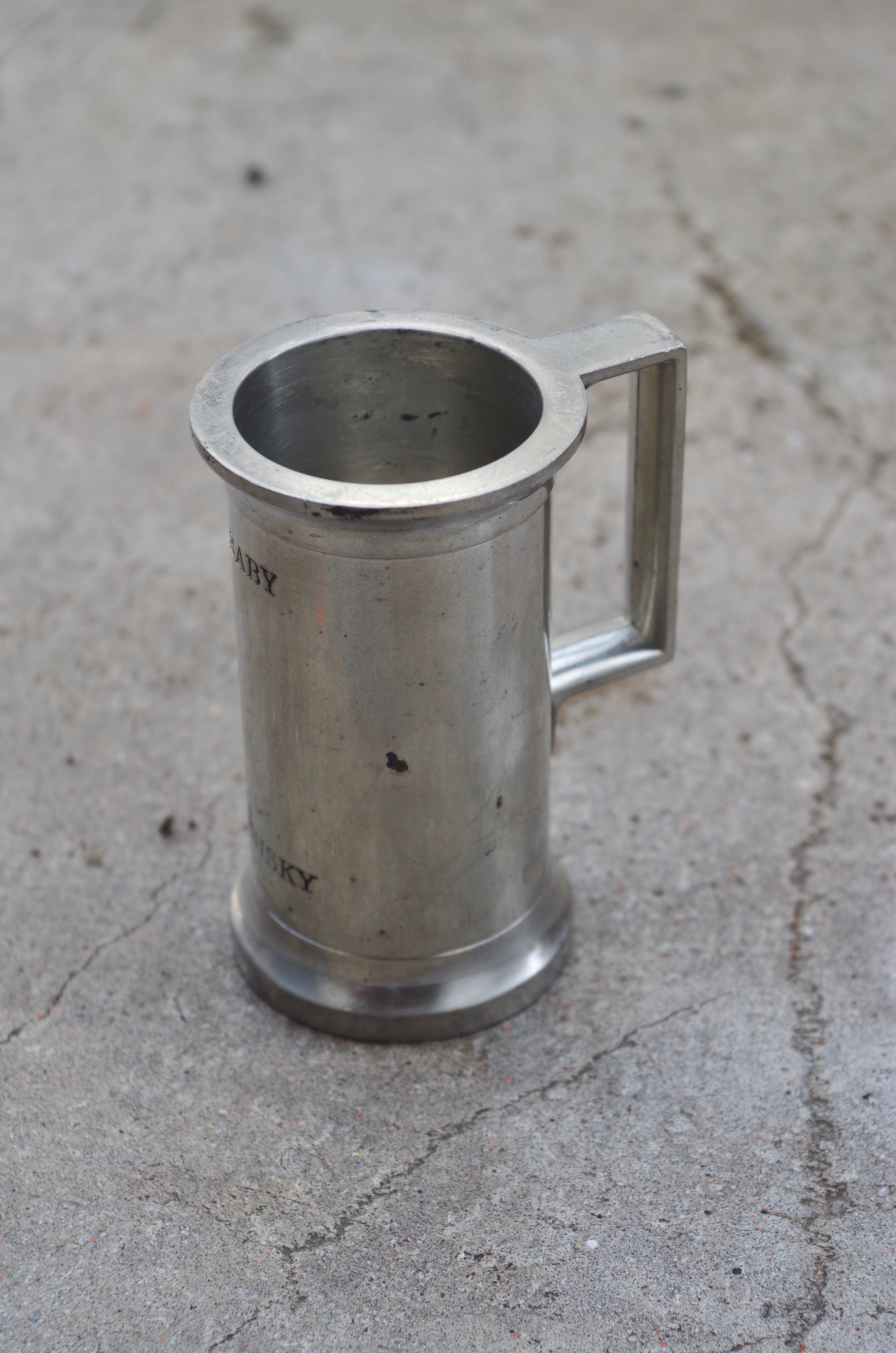 Concorde branded pewter whiskey jigger