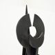 Black brutalist wooden sculpture