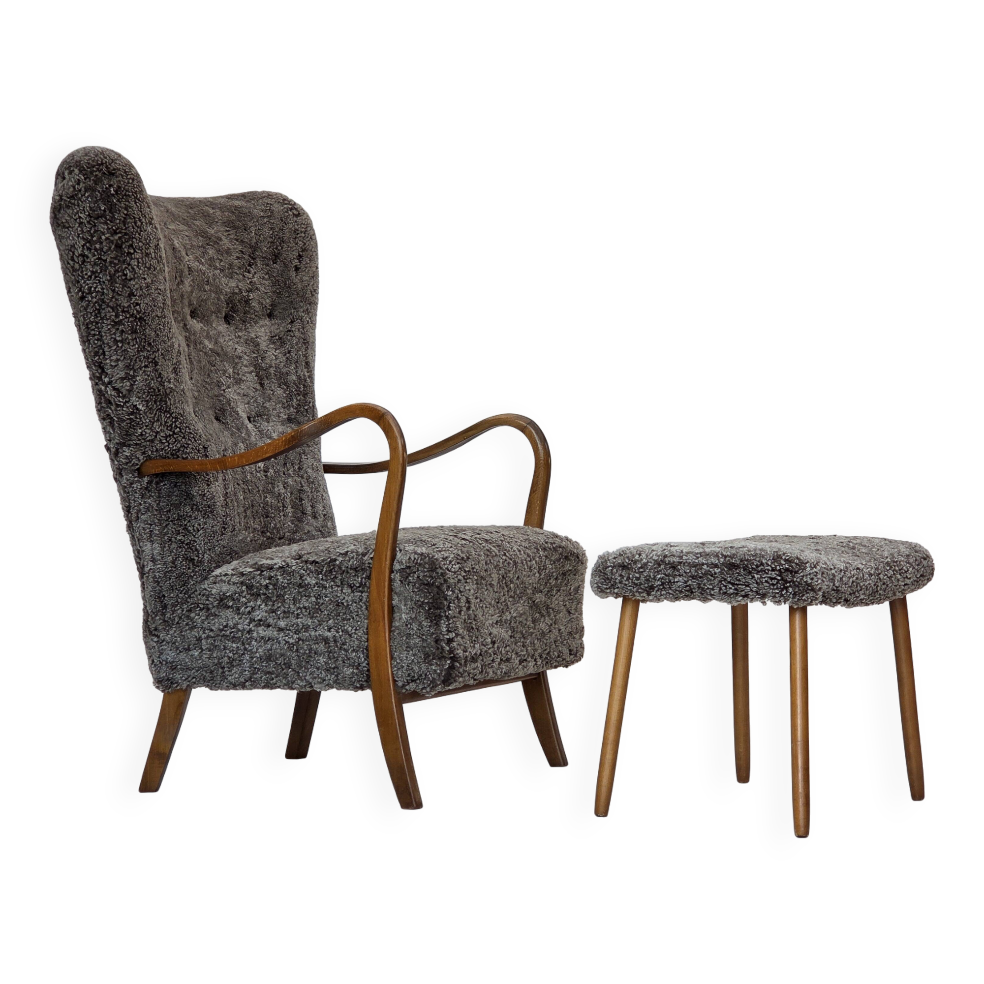 1960s, reupholstered Danish armchair, with stool, genuine sheepskin.