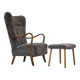 1960s, reupholstered Danish armchair, with stool, genuine sheepskin.