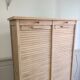 Antique furniture with double curtains sanded to white