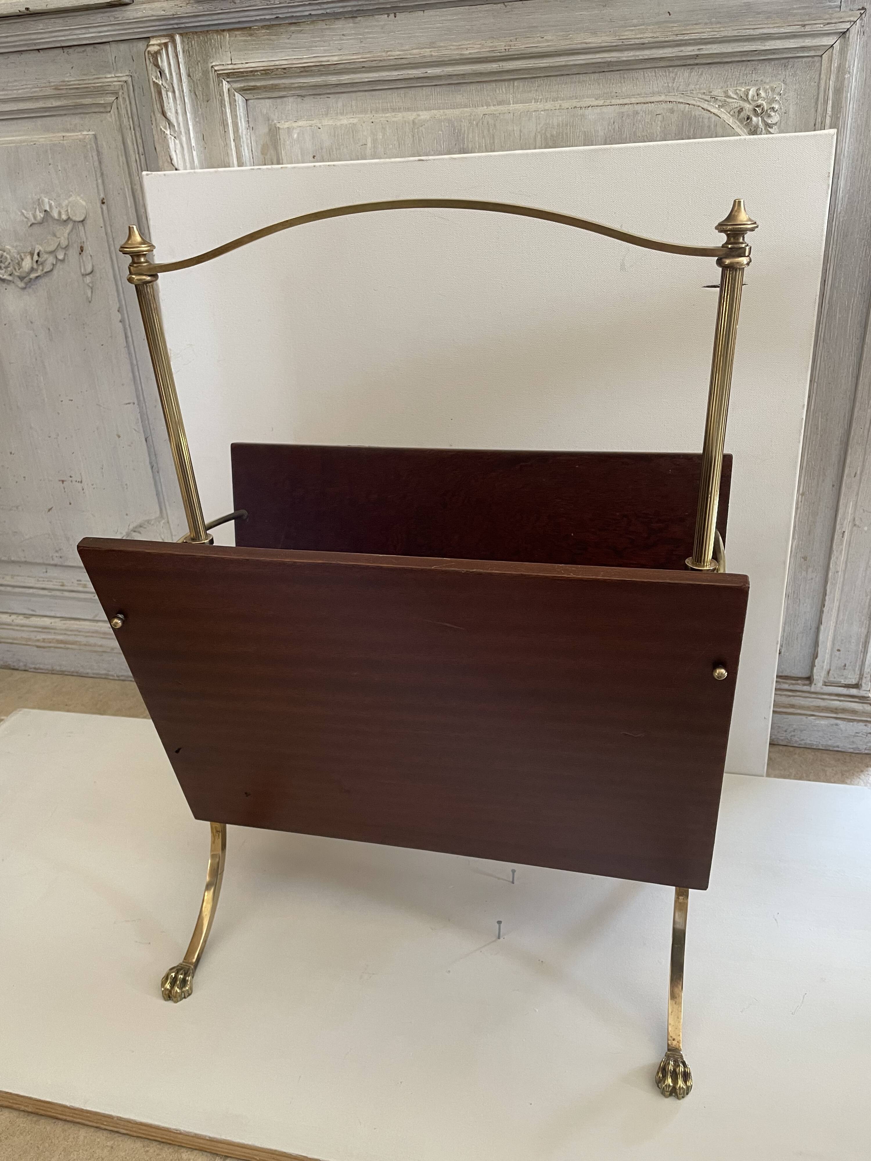 Magazine racks with claw feet by Maison Jansen