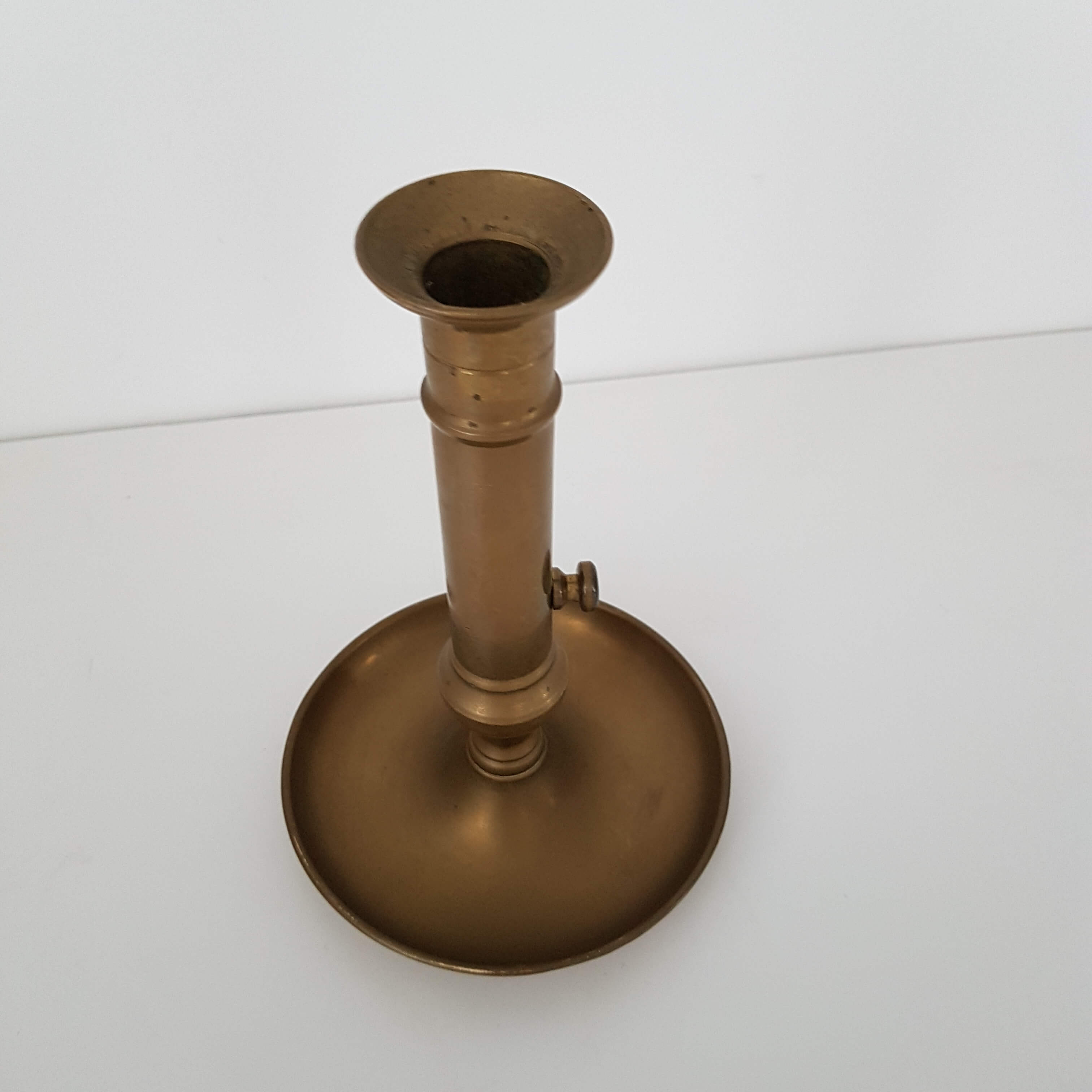 Brass pusher candle holder