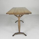 Art Deco bistro table with oak top on cast iron table