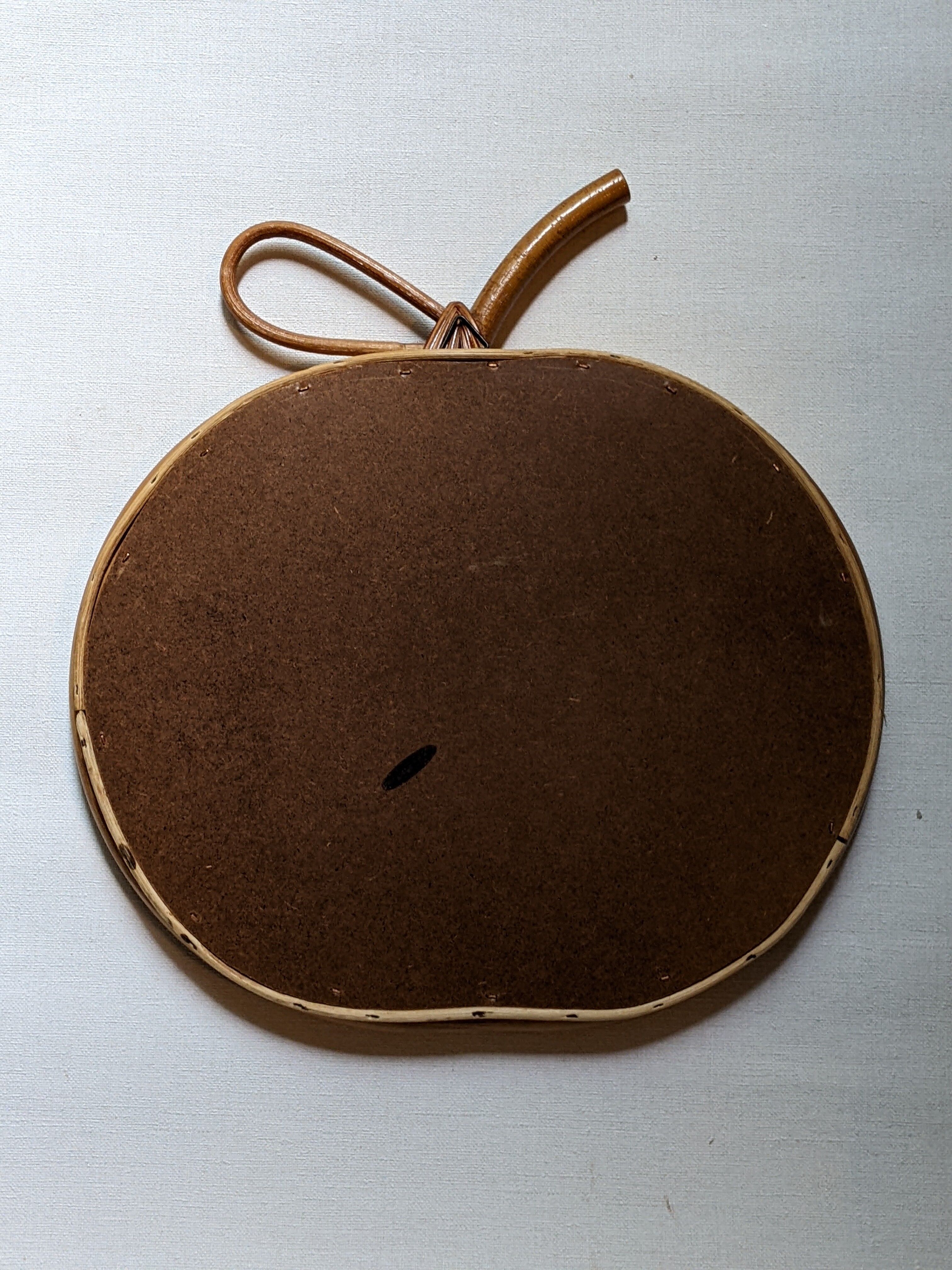 Vintage apple mirror in bamboo rattan from the 70s.