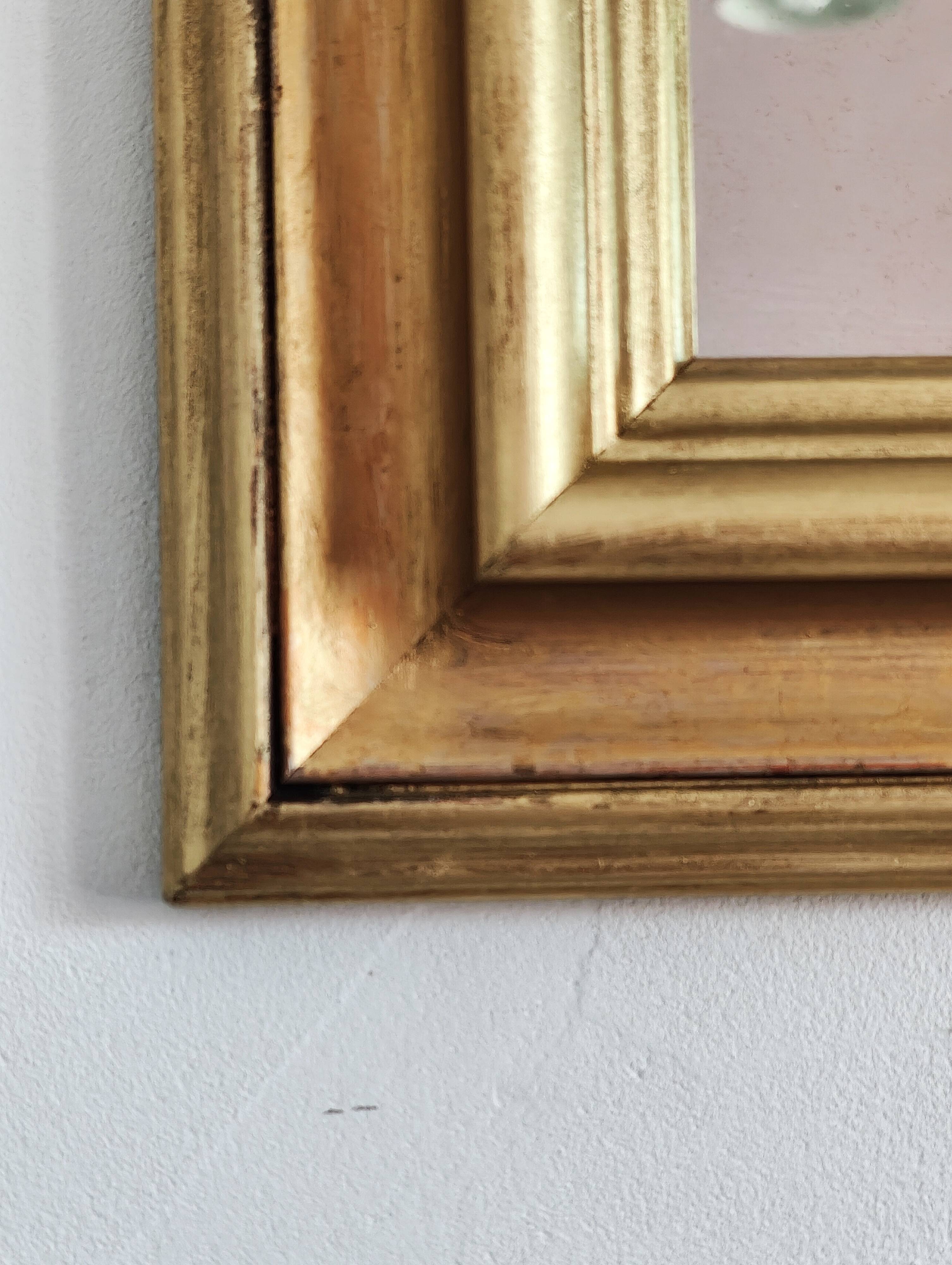 Miroir ancien en bois doré et cuivré