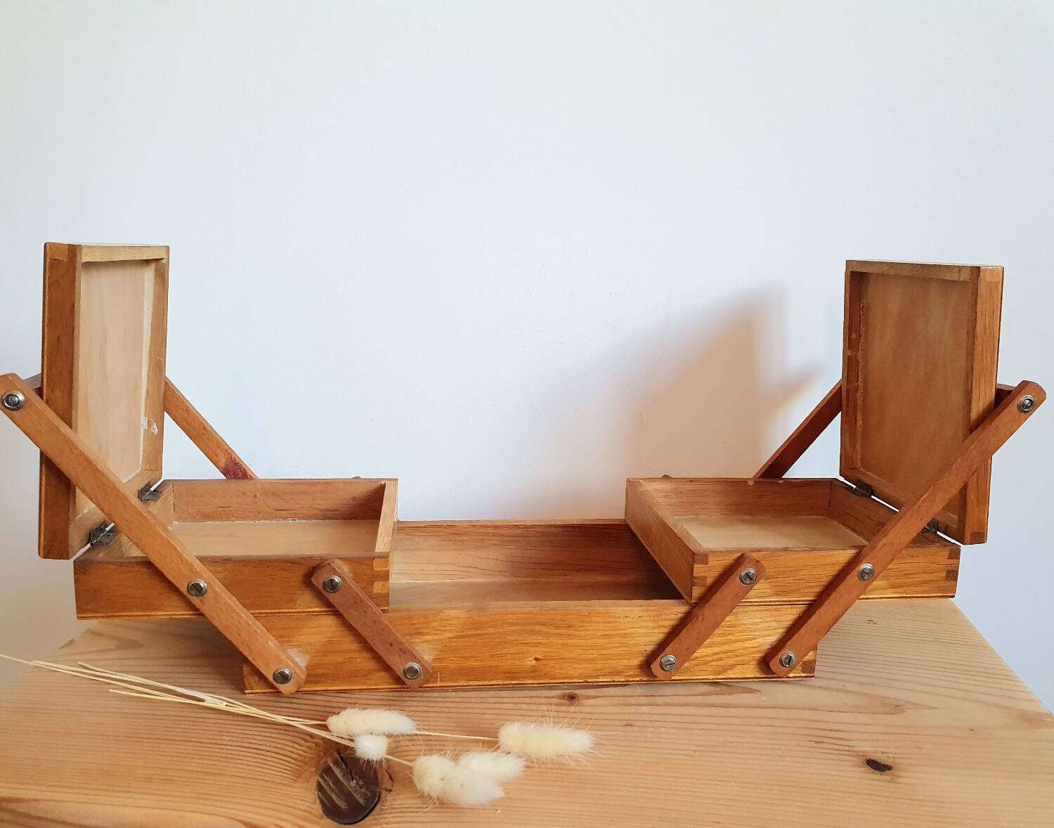 Small wooden sewing worker