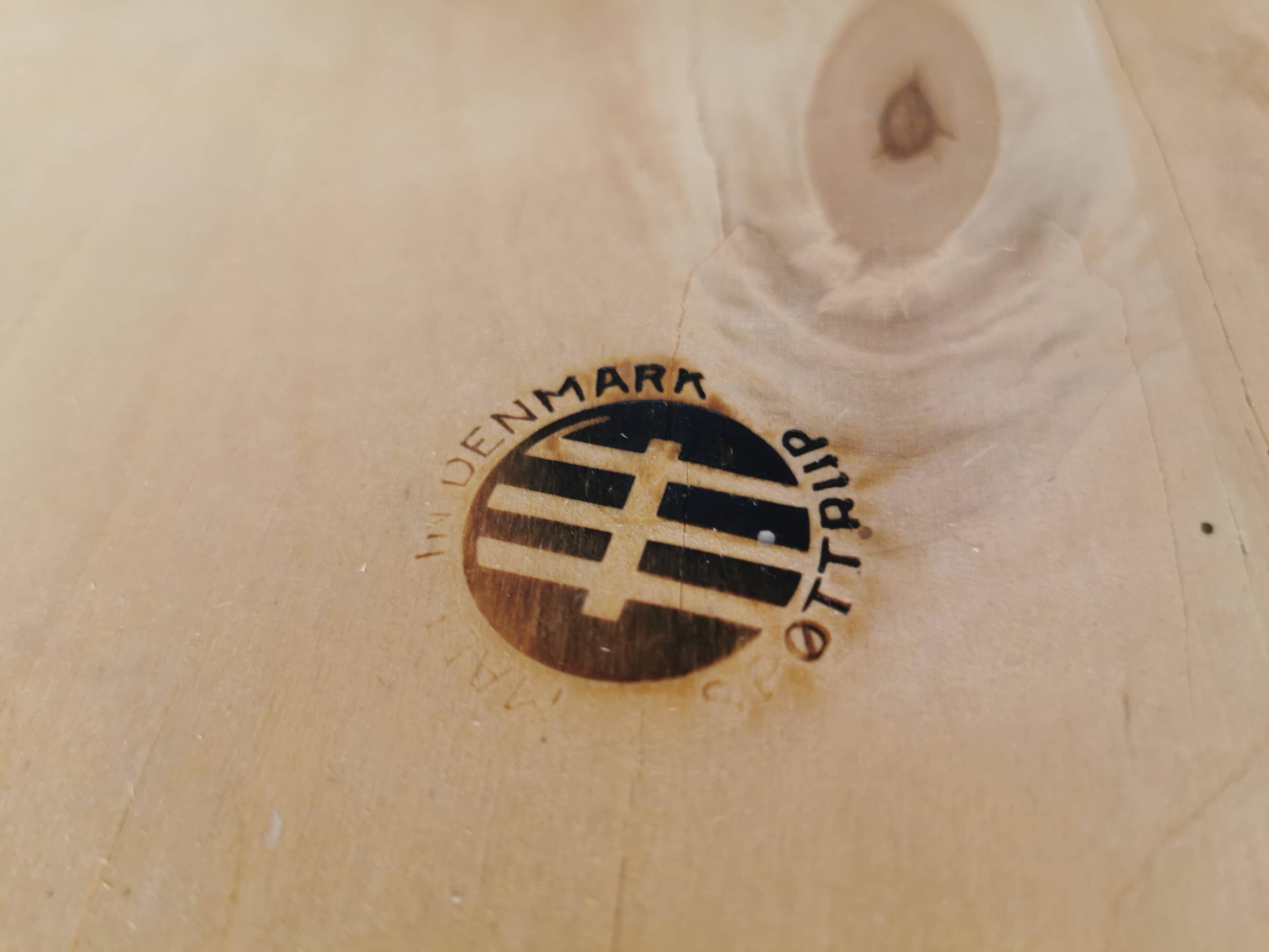 Danish designed footstool in teak wood and black skai “imitation leather”