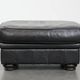 Large and timeless black ottoman made of cowhide leather in English style