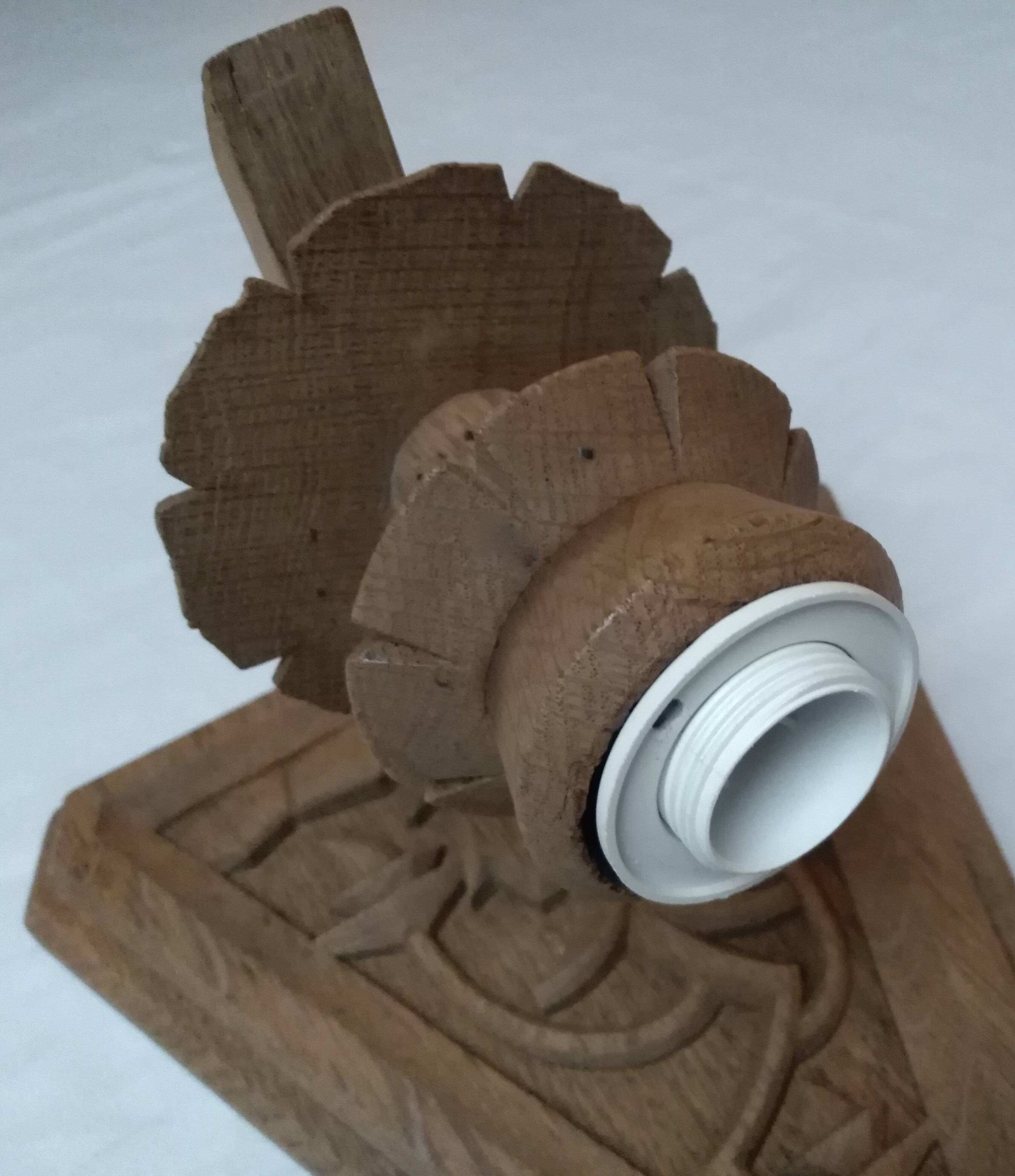 Old hand-carved wooden wall light