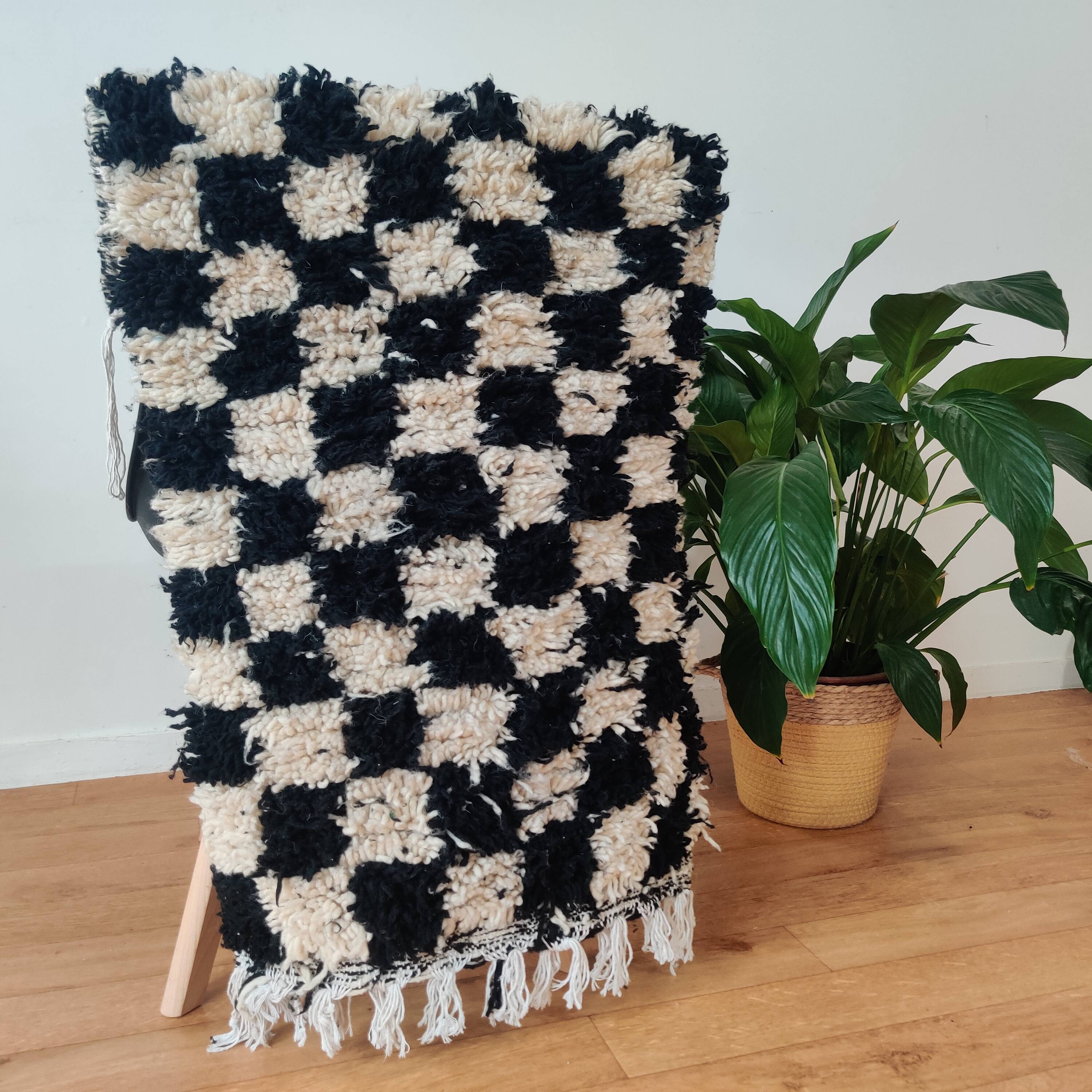 Small black tile Berber rug