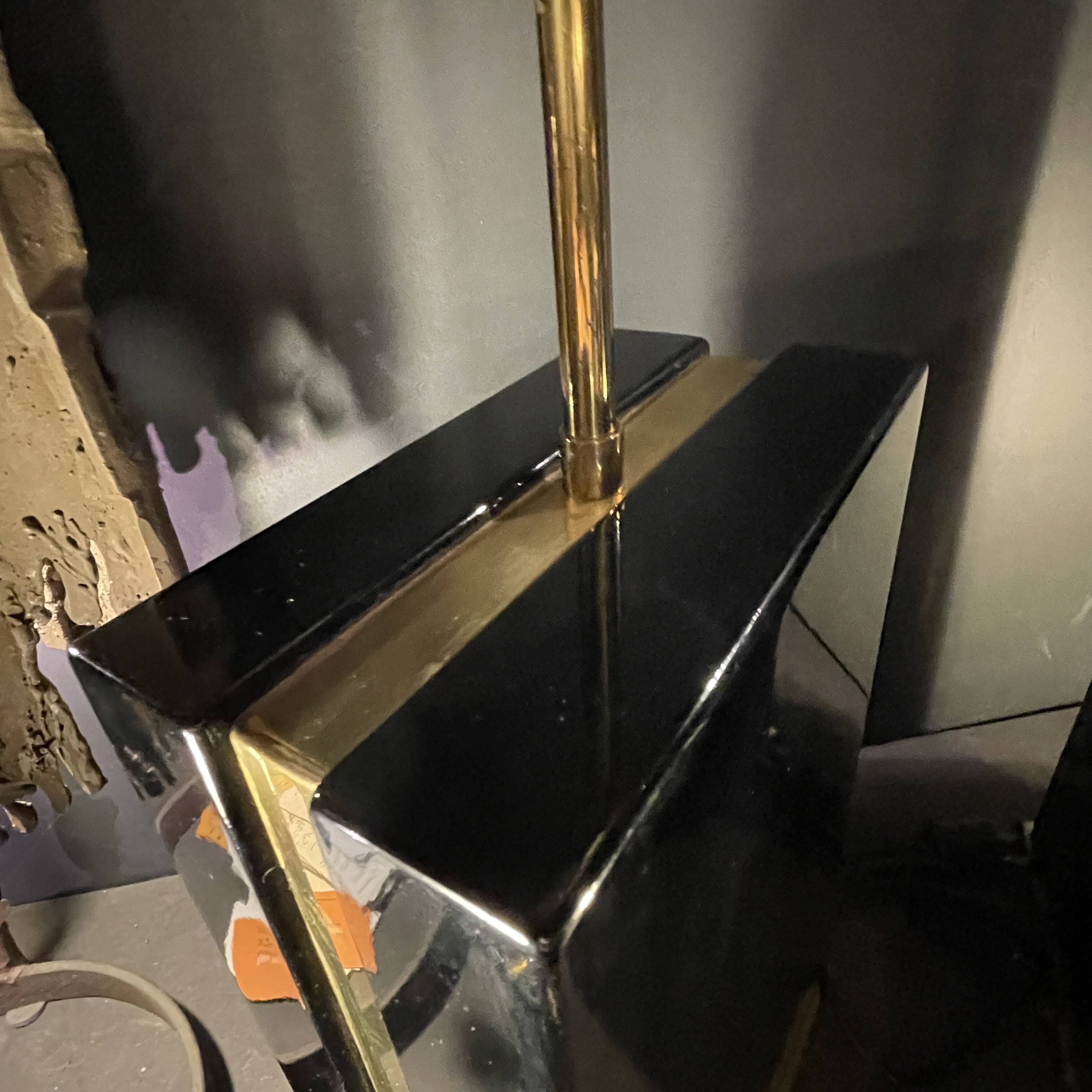 Pair of black lacquered and brass table lamps, circa 1970