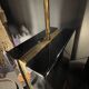 Pair of black lacquered and brass table lamps, circa 1970