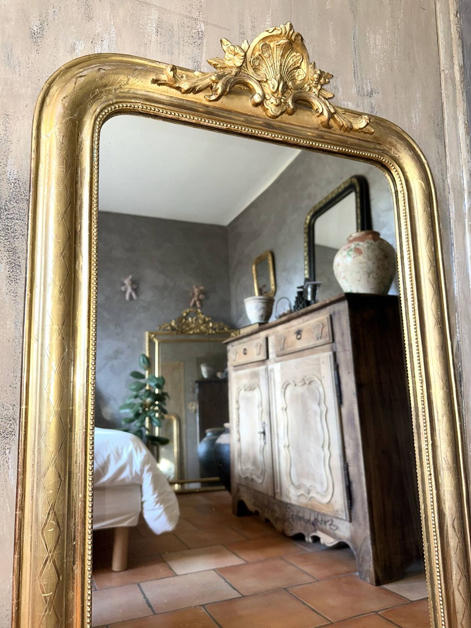 Antique Louis-Philippe gilded mirror from the late 19th century.