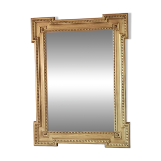 Grand miroir en bois doré glace biseautée