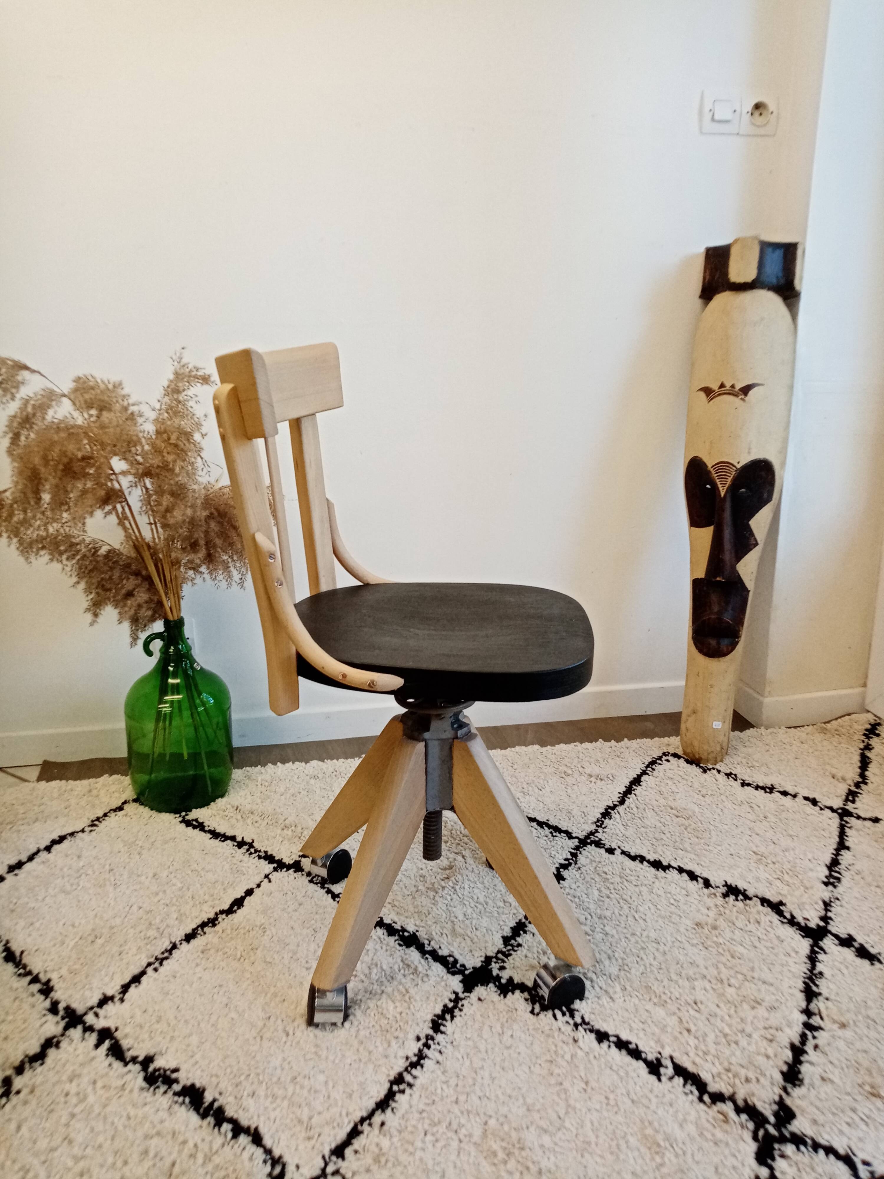 Black and wood workshop chair with metal base