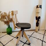 Black and wood workshop chair with metal base