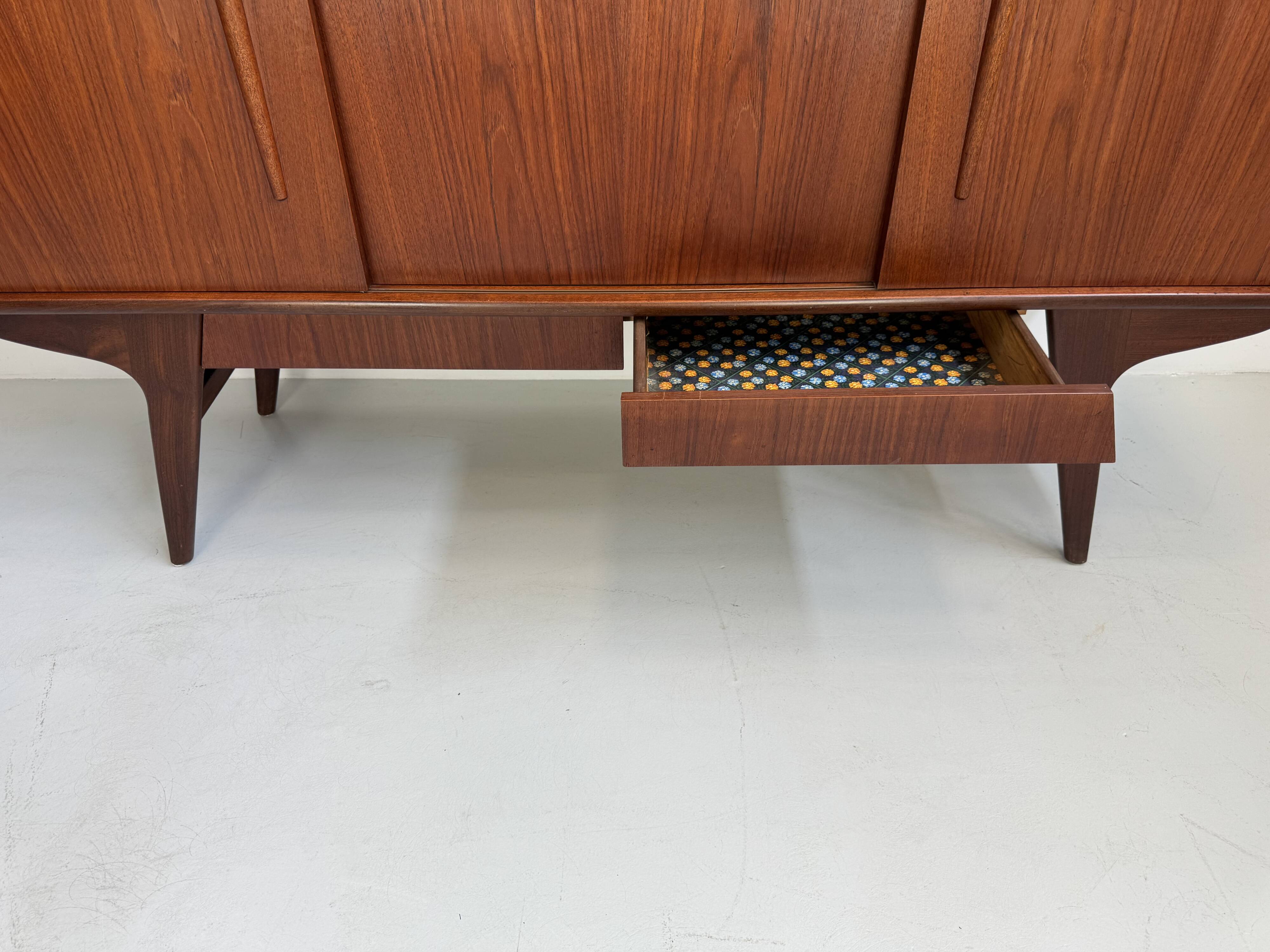 Vintage Danish teak wall unit with sliding doors from the 1960s.