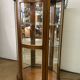 Wooden display case and half-moon mirror