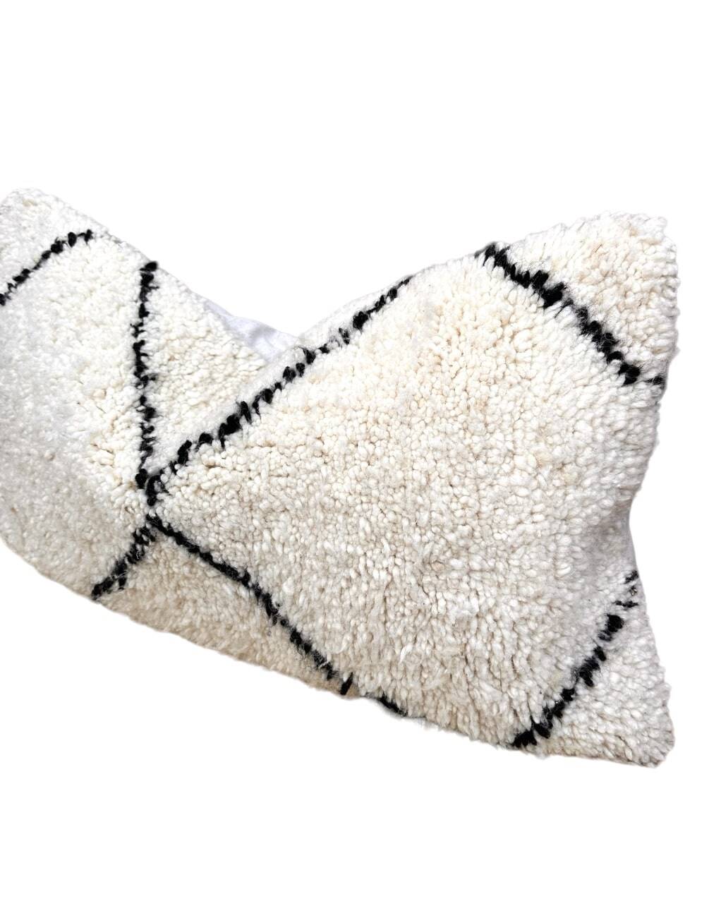 Bohemian wool pillow cover on a Beni Ourain Berber cushion. The cushion cover