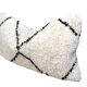 Bohemian wool pillow cover on a Beni Ourain Berber cushion. The cushion cover