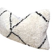 Bohemian wool pillow cover on a Beni Ourain Berber cushion. The cushion cover