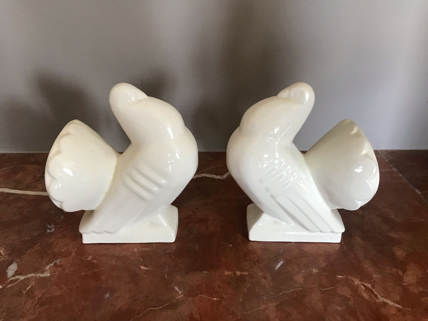 Pair of bookends in ceramic art deco cracked pigeons signed