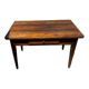 Old wooden table with a drawer