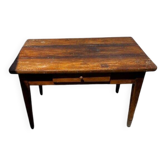 Old wooden table with a drawer
