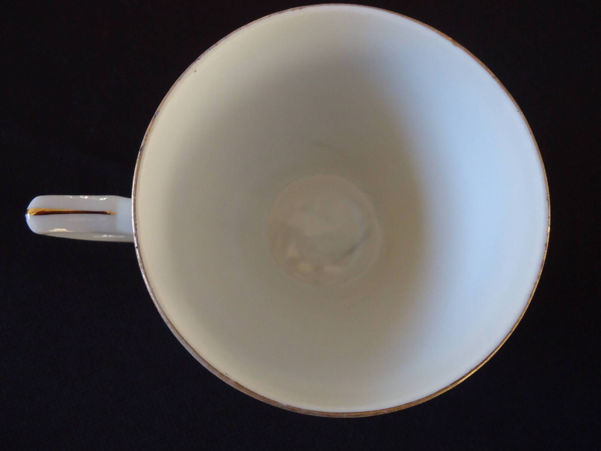 Set of six Art Deco white fine porcelain coffee cups and saucers