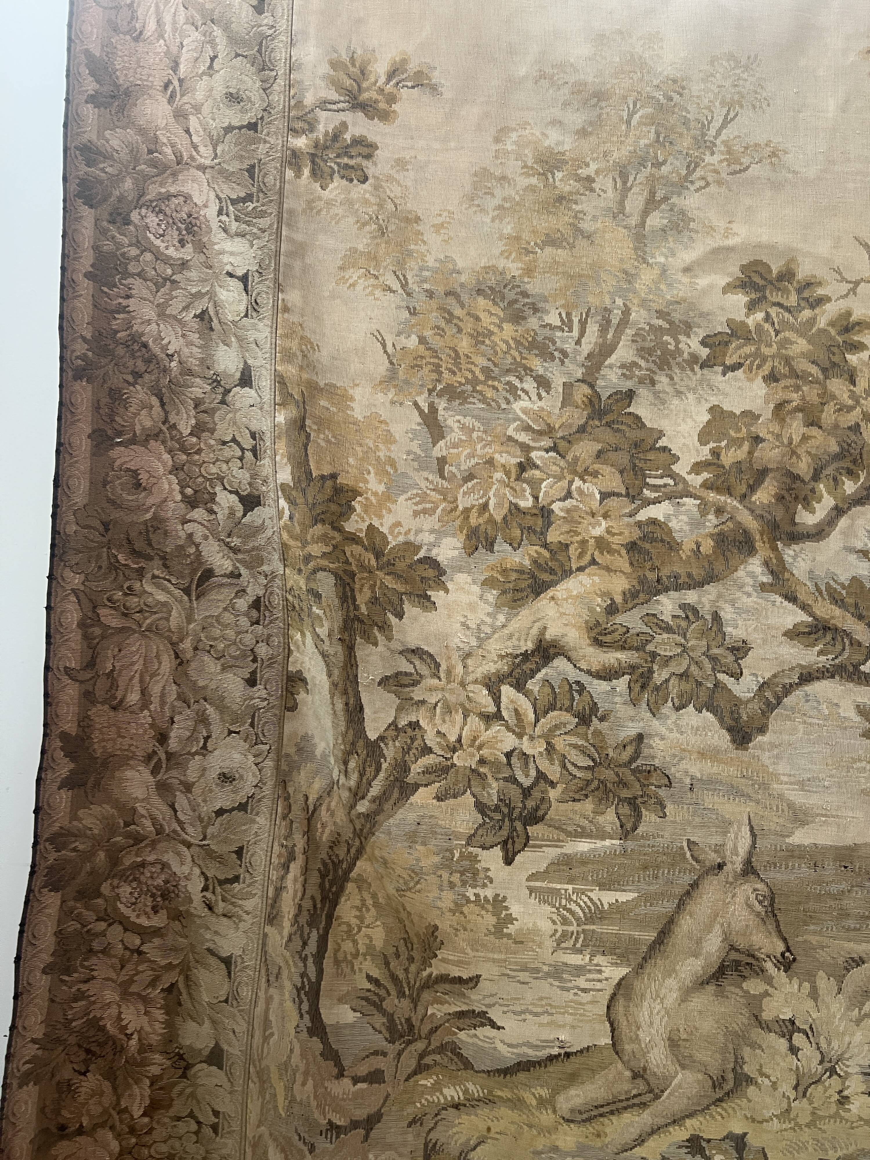Renaissance-style tapestry with animal motifs, 20th century.