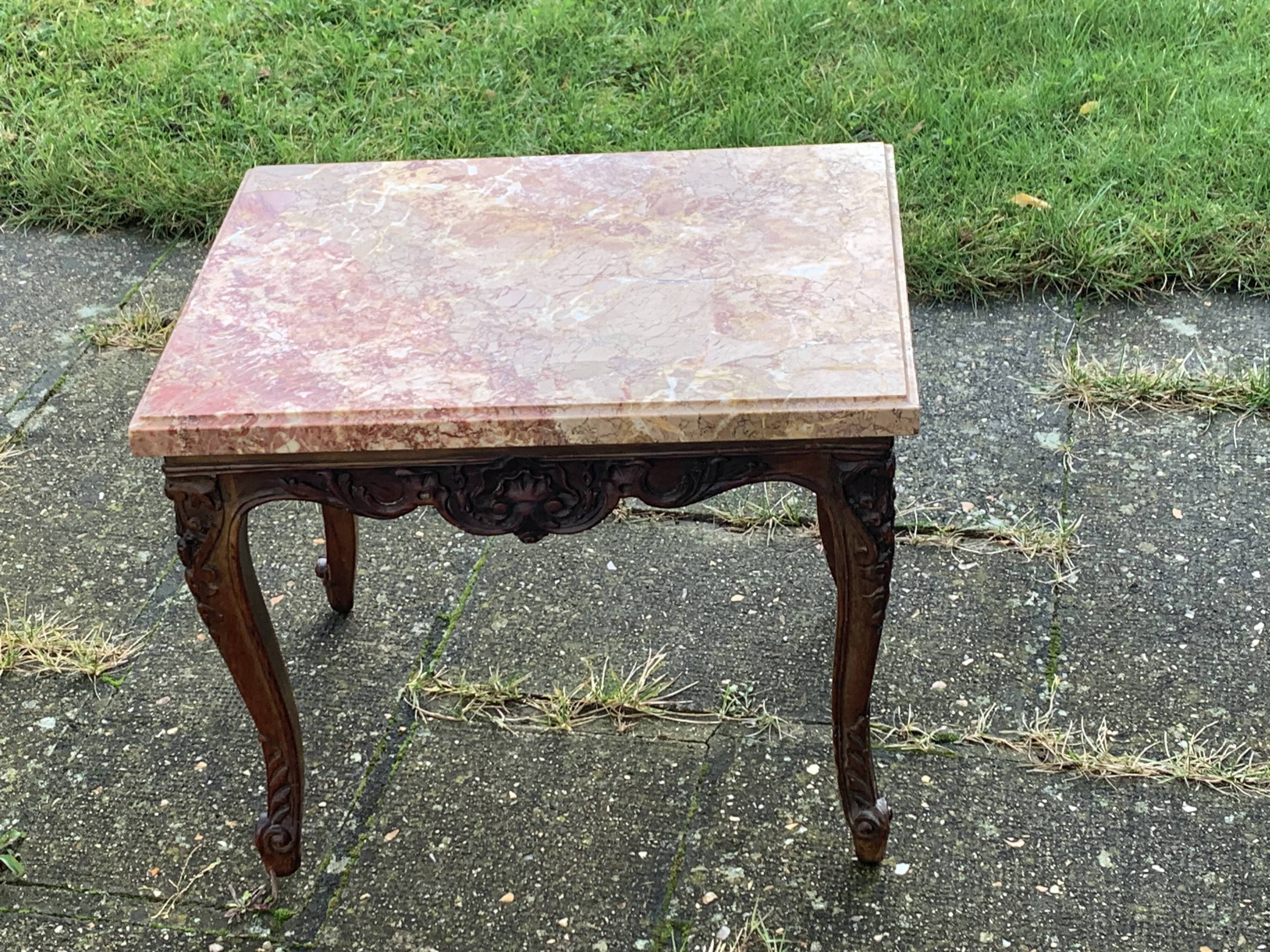 Carved wooden coffee table with shell pattern and removable pink marble top, old