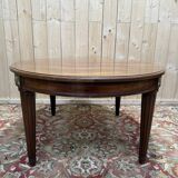 Oval dining table in Louis XVI style made of mahogany.