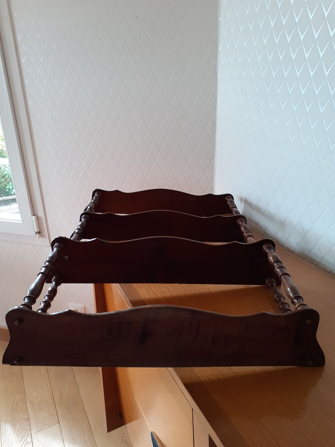 Turned wooden wall shelf