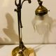 Brass table lamp with a glass shade