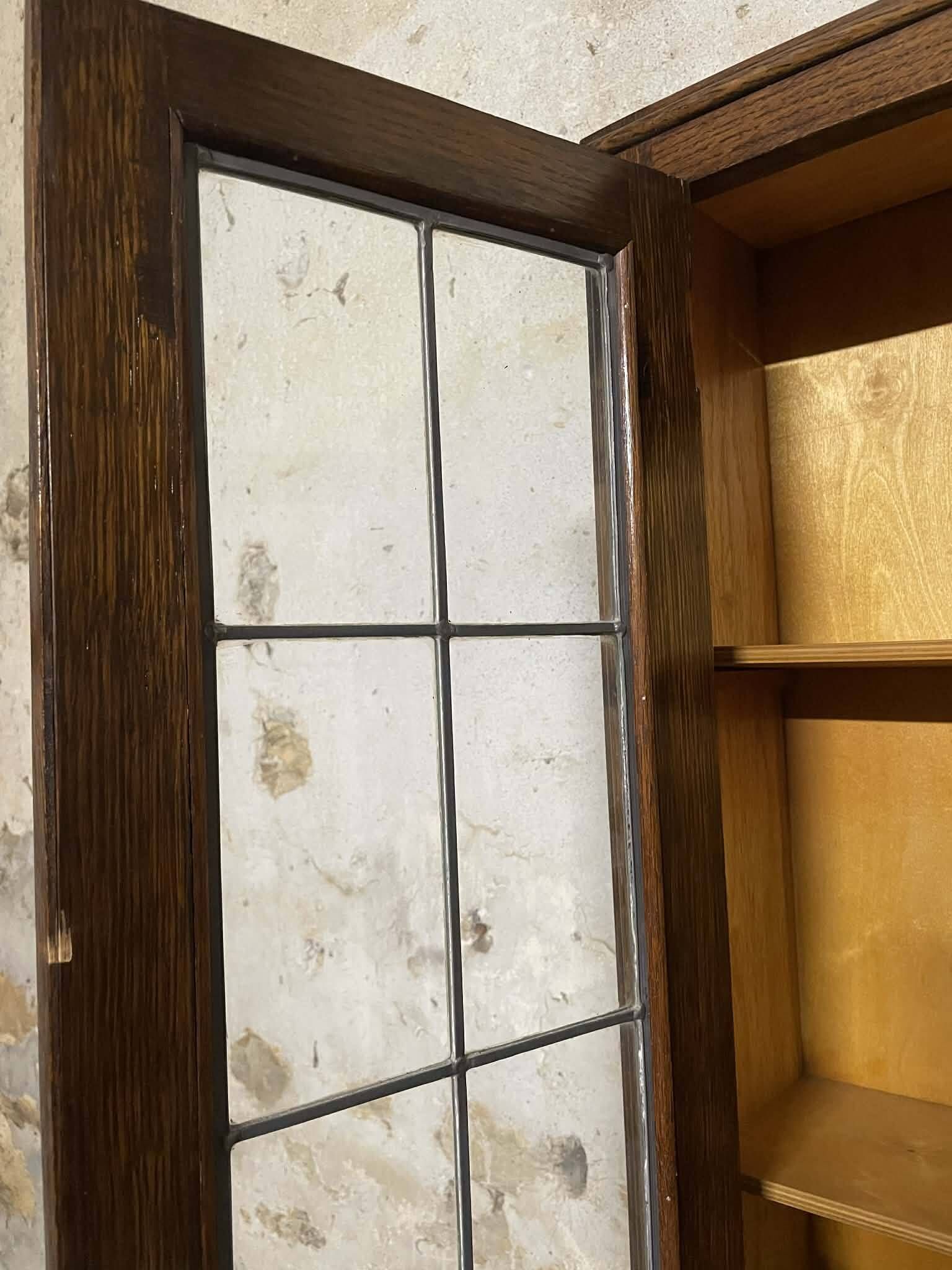 Oak display secretary cabinet with drop-down front, two sections.