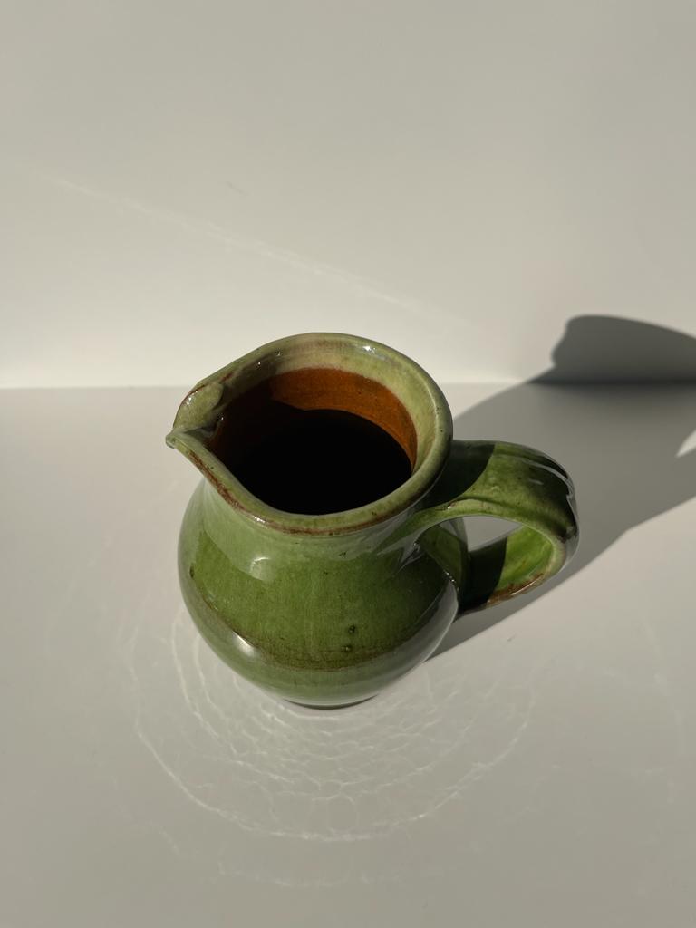 Green glazed ceramic pitcher