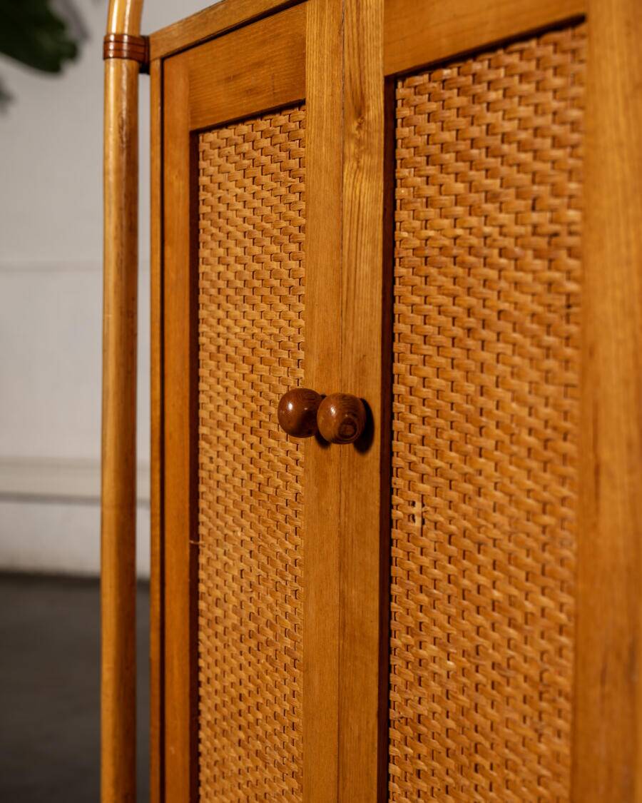 Small storage unit in cane and wood.