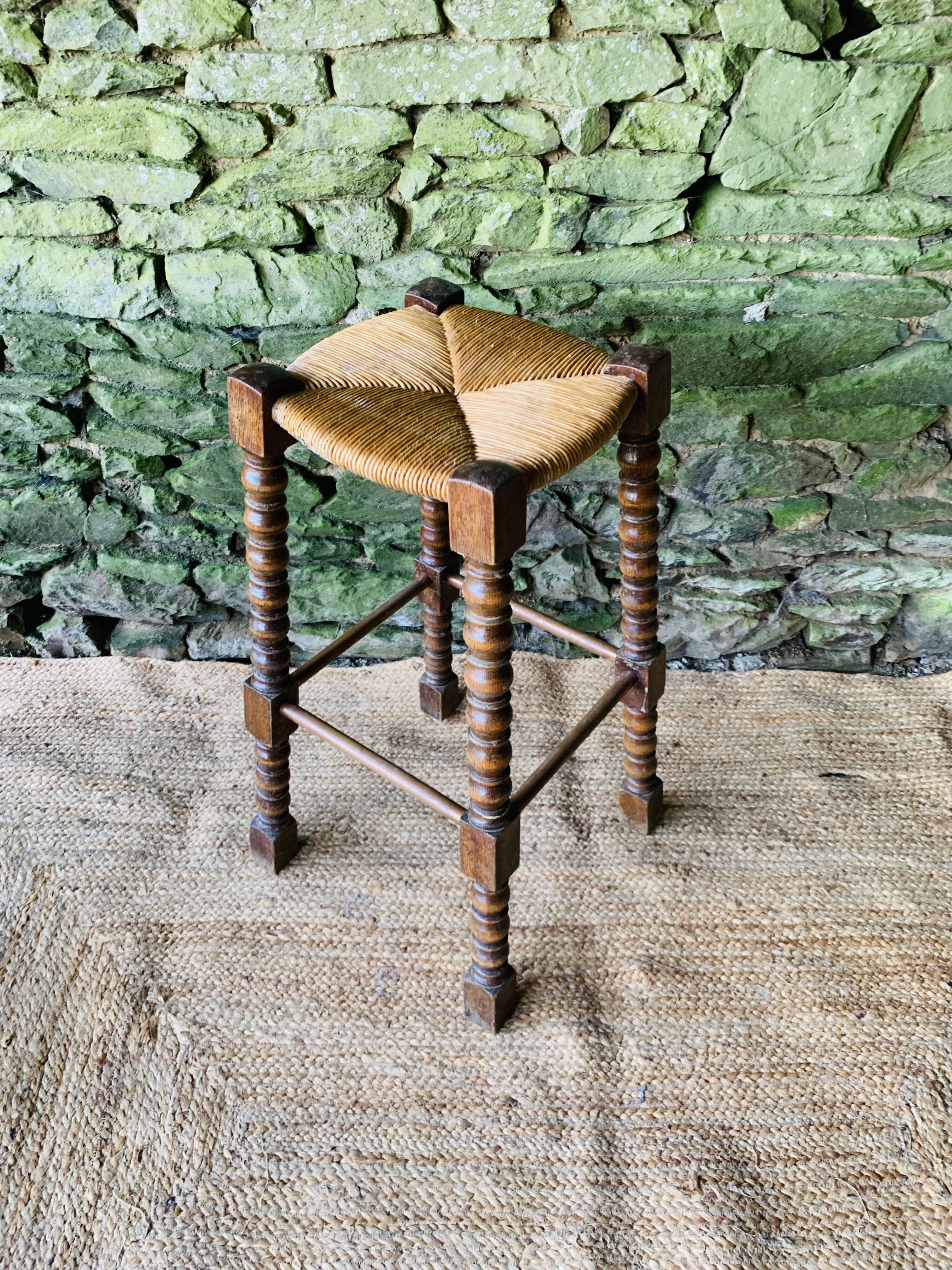 High stool in turned wood