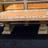Table composed of a carved stone base with marble and hard stone inlay decoration