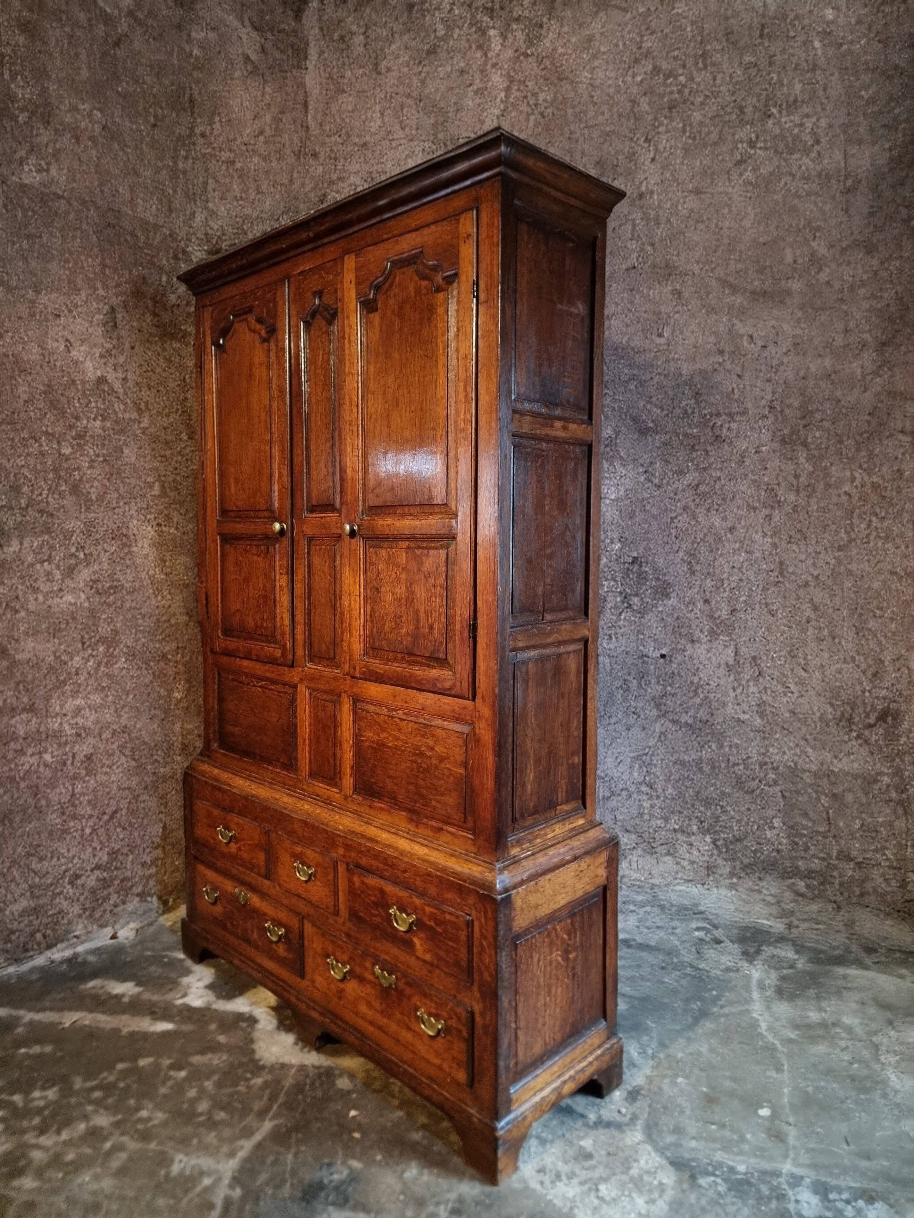 Antique English oak wardrobe with drawers, England, circa 1800–1820.