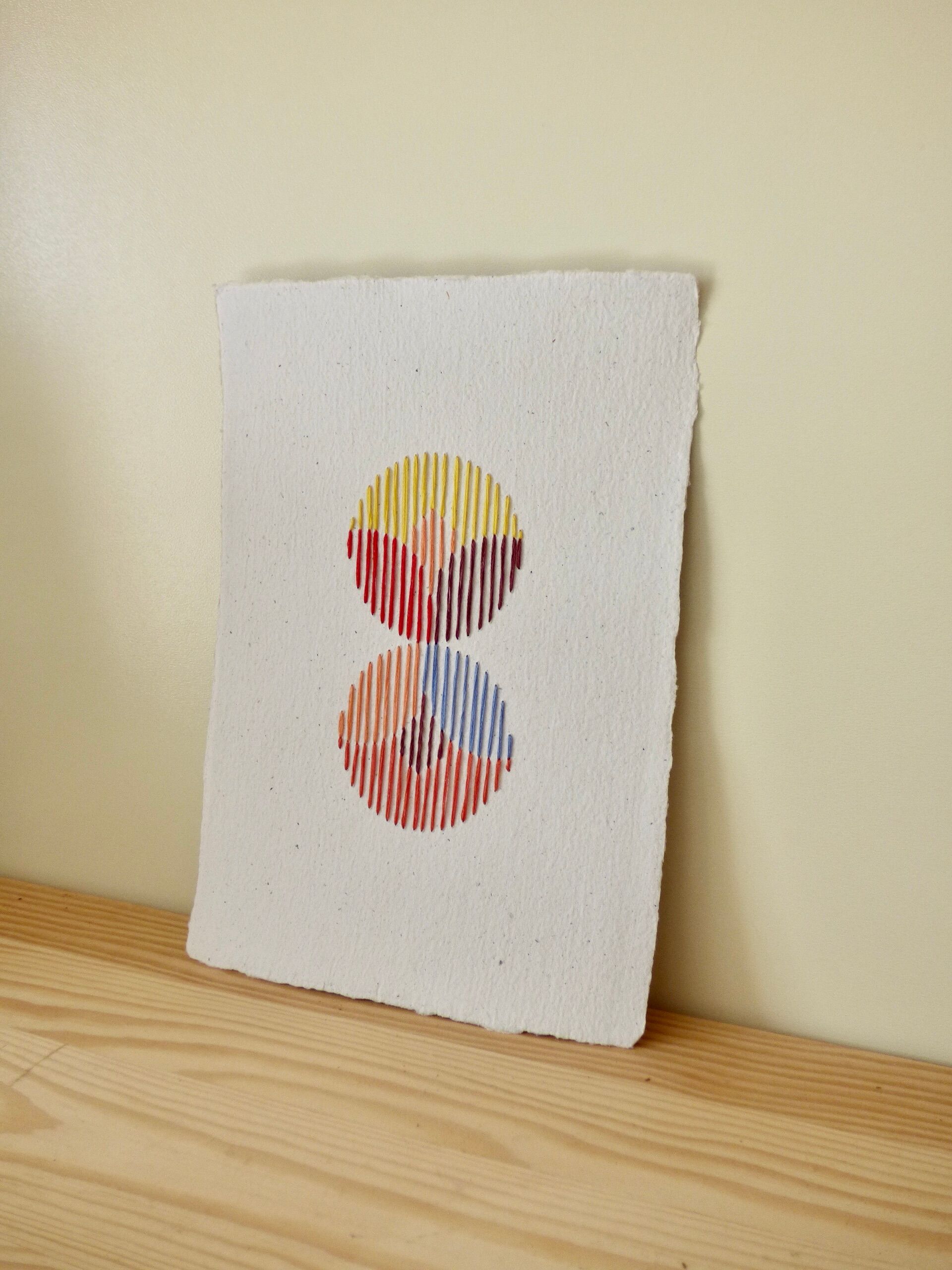 hand-embroidered card on recycled paper