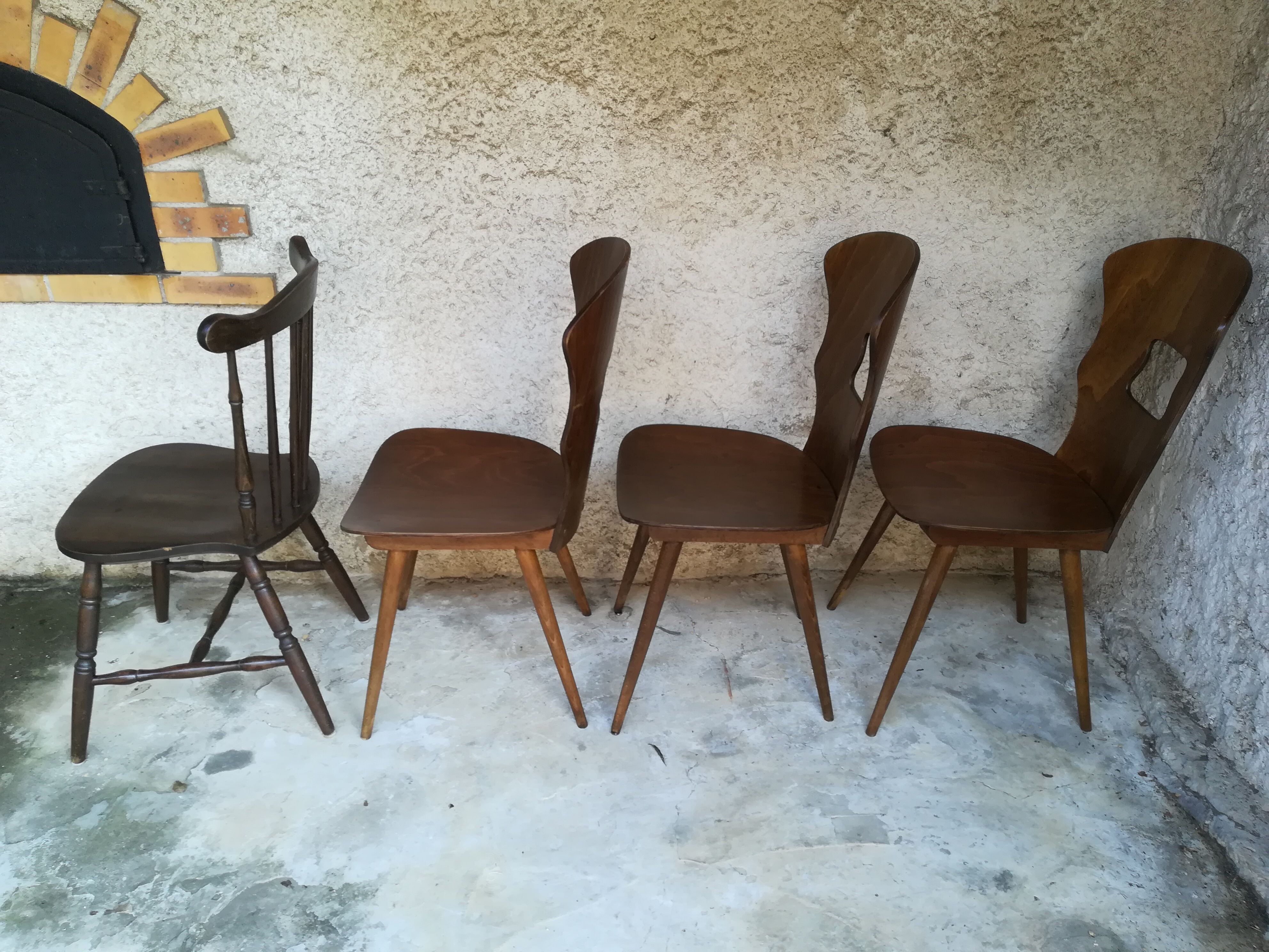 Eight mismatched bistro chairs
