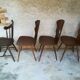 Eight mismatched bistro chairs