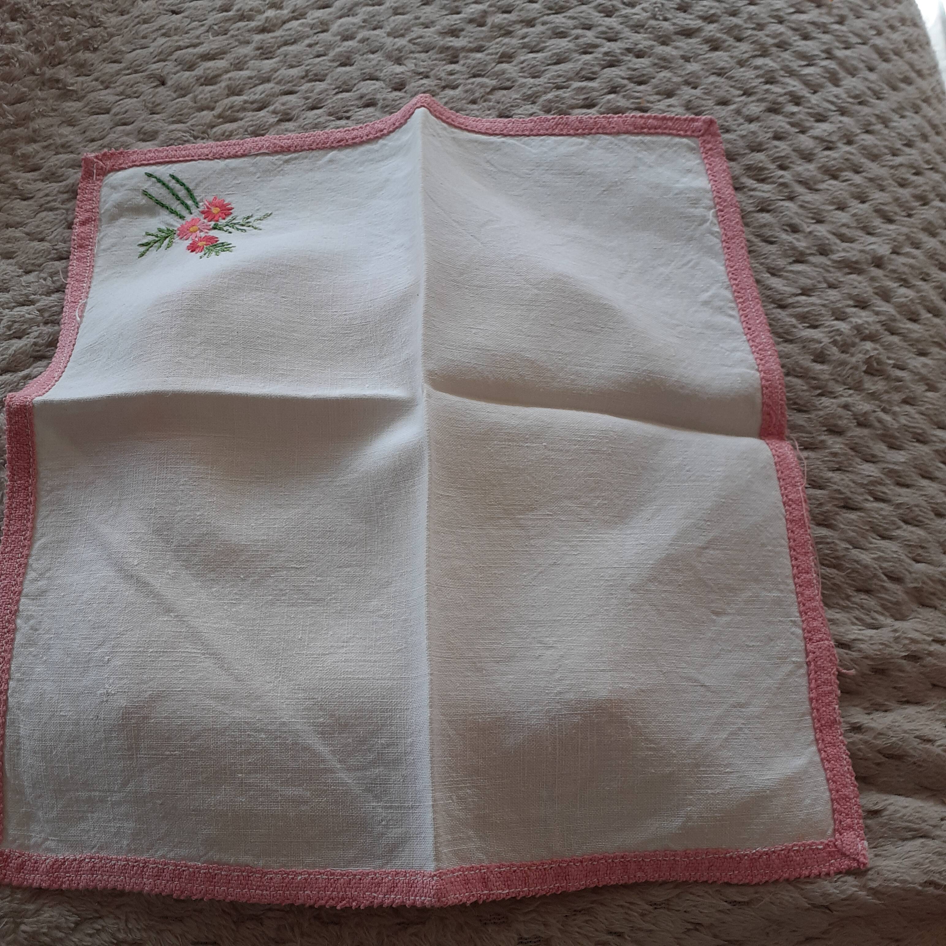 8 Napkins with handmade flower borders.