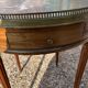 Mahogany hot water bottle table with brass net