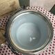 English porcelain and silver-plated metal cake tin
