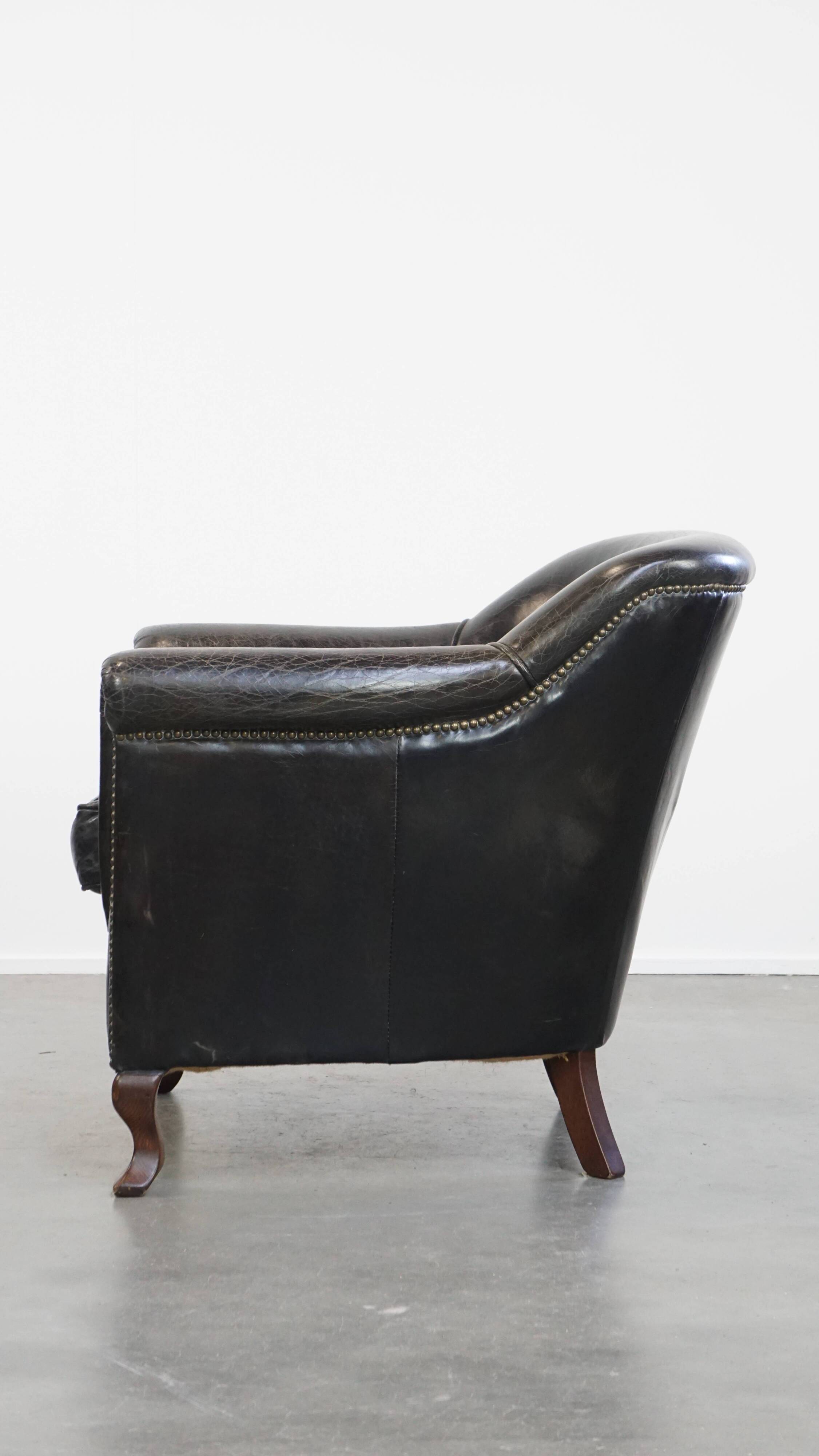 Black grained cowhide leather armchair